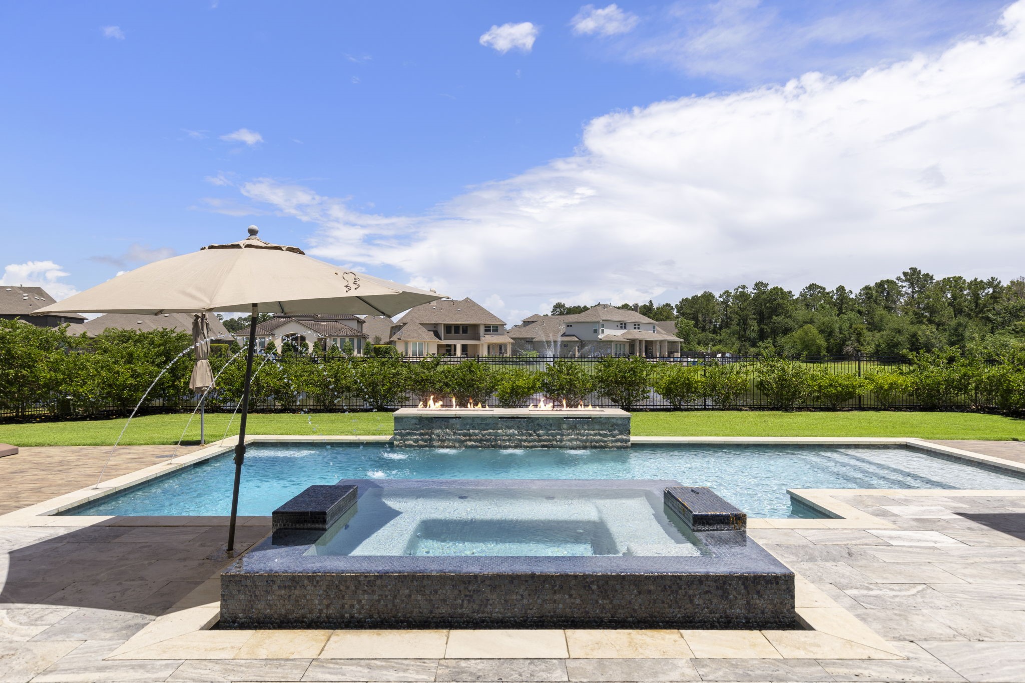 6806 West Warwick Lake Lane Spring, TX 77389 - Photo 46 of 50 a view of a swimming pool with an outdoor seating and a yard