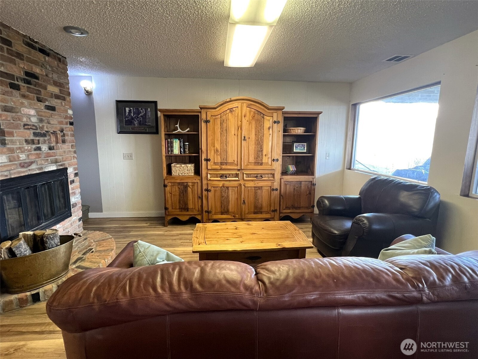 81 B Golden Road Oroville, WA 98844 - Photo 17 of 37 a living room with furniture and a fireplace