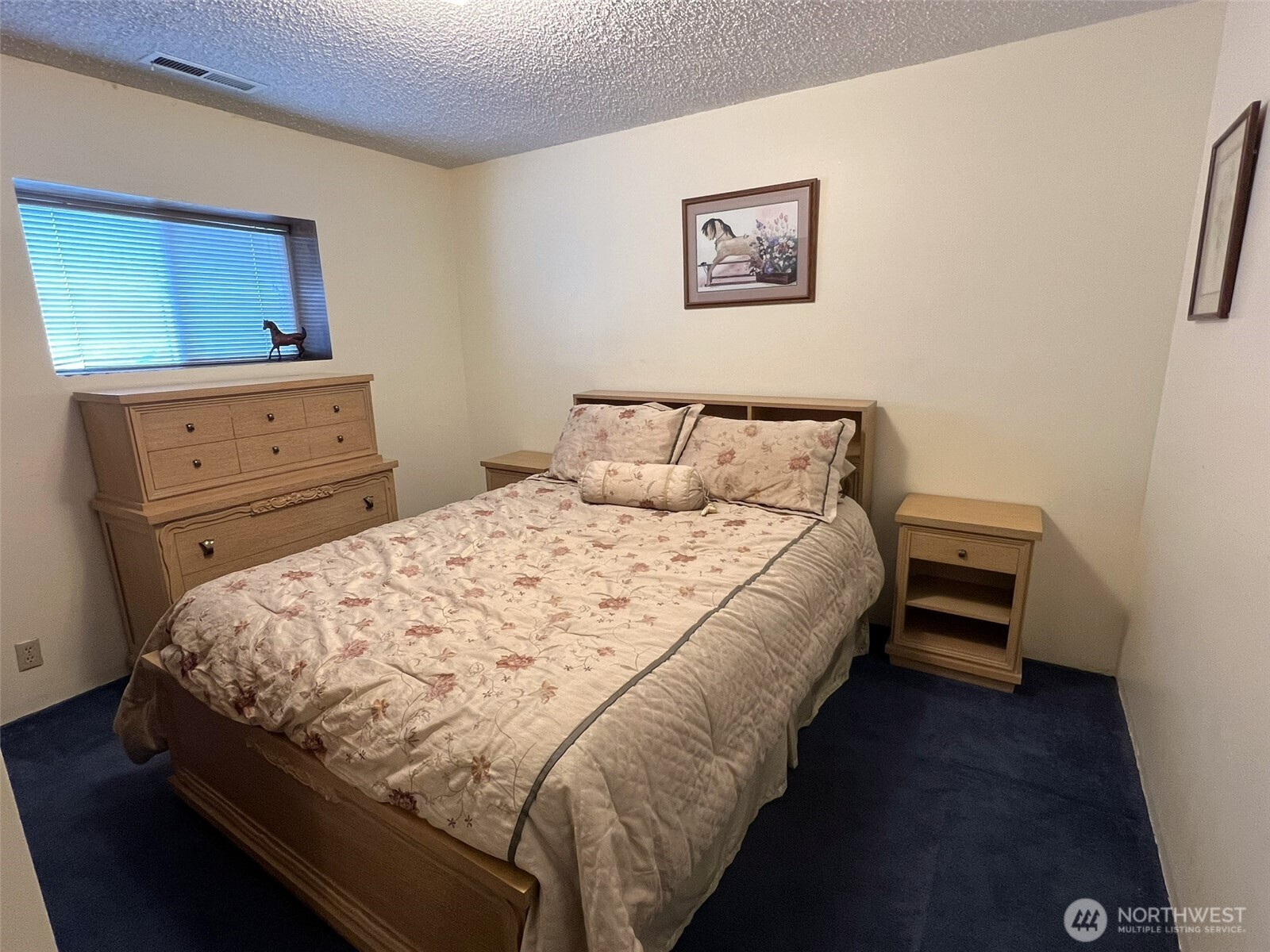 81 B Golden Road Oroville, WA 98844 - Photo 18 of 37 a bed sitting in a bedroom and wooden floor