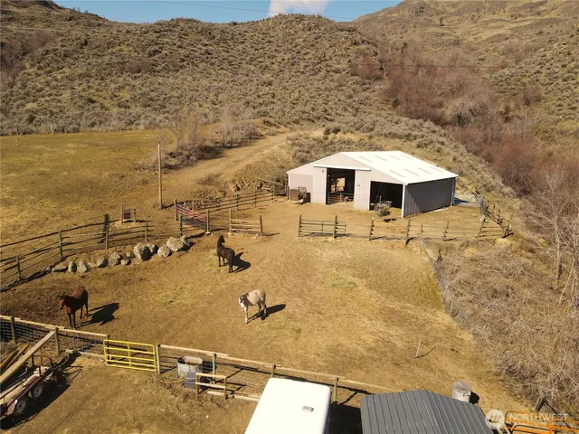 an aerial view of a house with ocean view