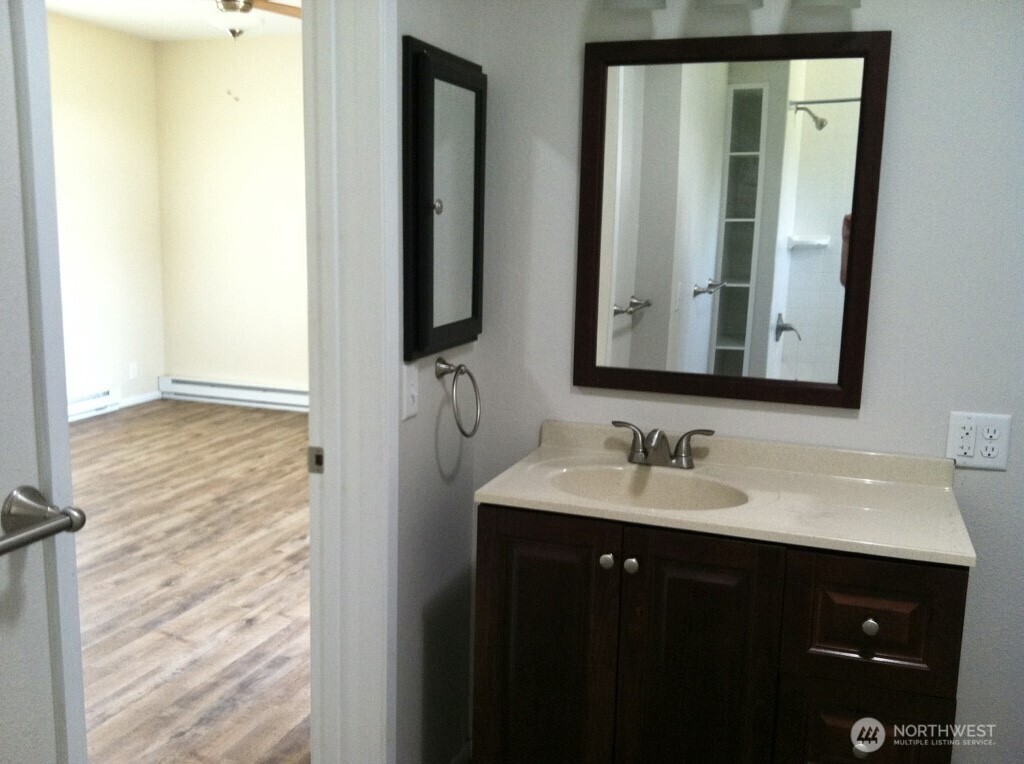 81 B Golden Road Oroville, WA 98844 - Photo 27 of 37 a bathroom with a double vanity sink and a mirror