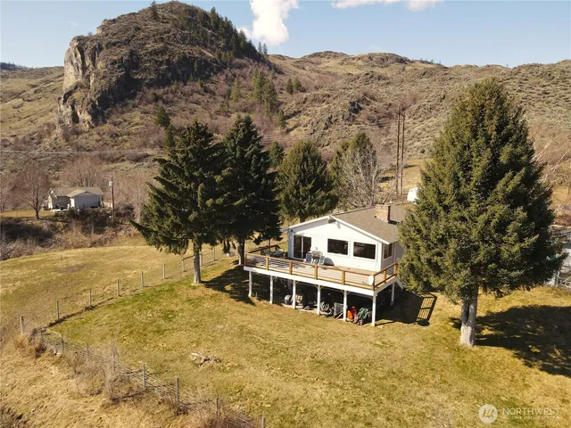 a view of a large building with a mountain in the background