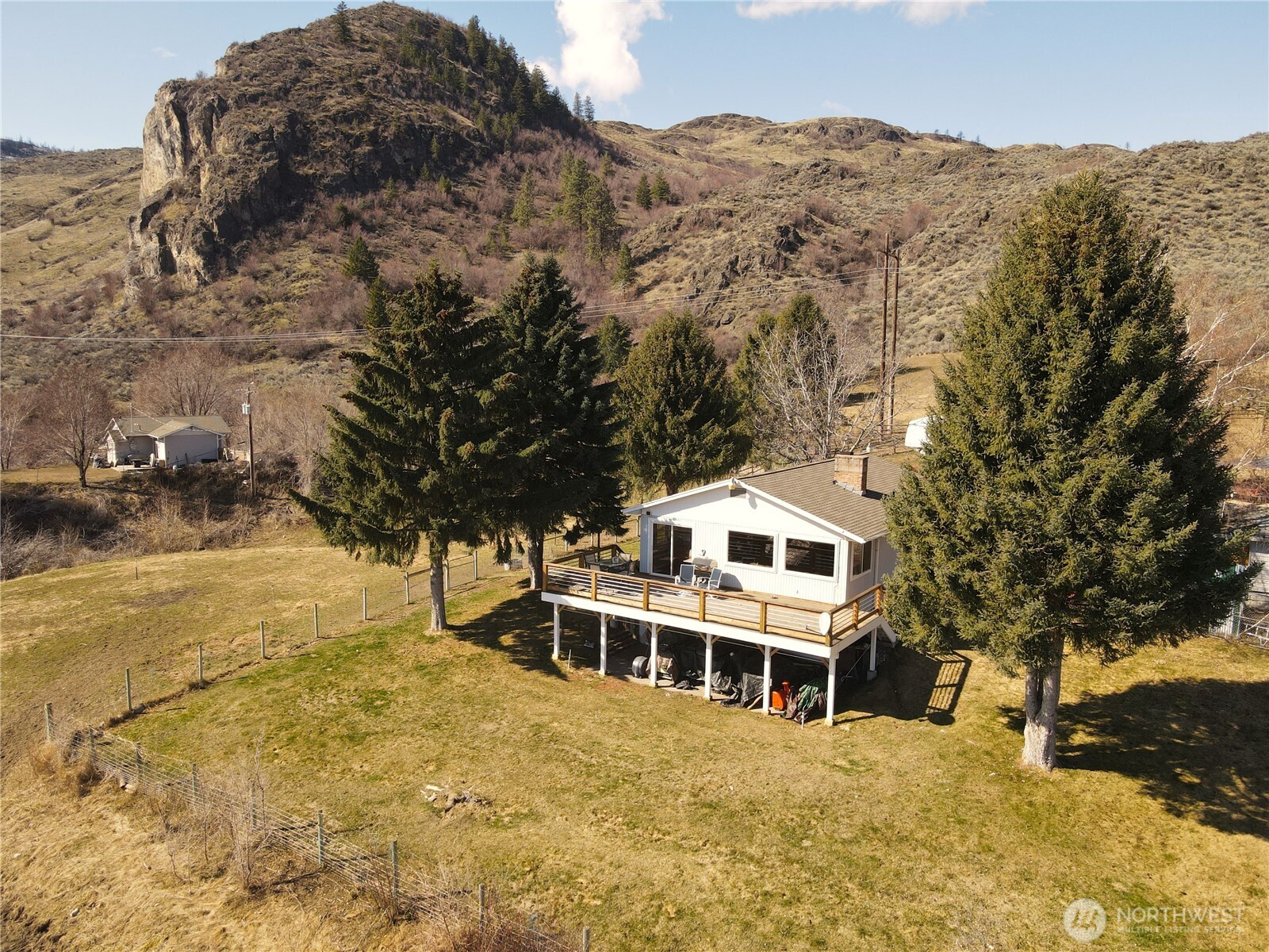 81 B Golden Road Oroville, WA 98844 - Photo 4 of 37 a view of a large building with a mountain in the background
