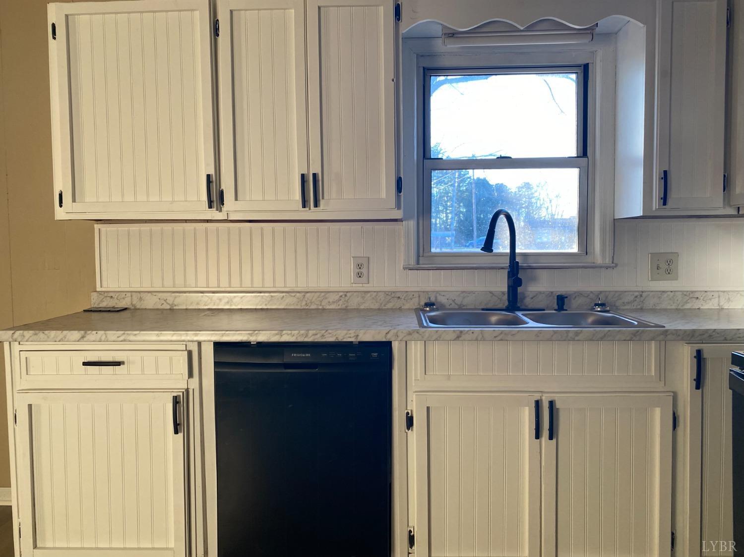 5936 Riceville Road Gretna, VA 24557 - Photo 6 of 19 a kitchen with a sink cabinets and a window