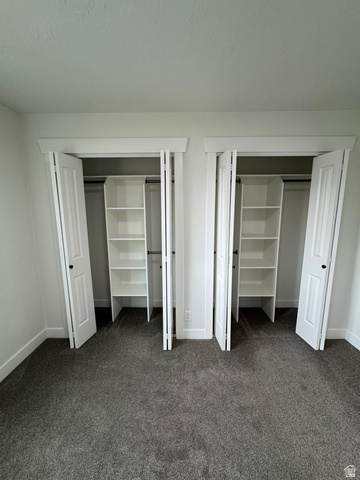 608 South 500 West, Unit 3 Provo, UT 84601 - Photo 27 of 35 Room featuring two closets with white bi-fold doors, each equipped with built-in shelving units and hanging rods