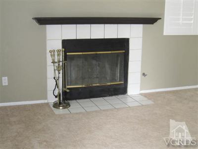 1195 Fitzgerald Road Simi Valley, CA 93065 - Photo 3 of 21 a living room with a fireplace