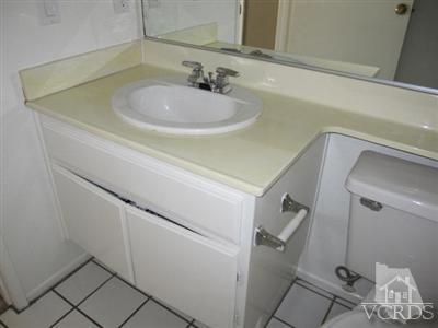 1195 Fitzgerald Road Simi Valley, CA 93065 - Photo 10 of 21 a bathroom with a sink and a mirror
