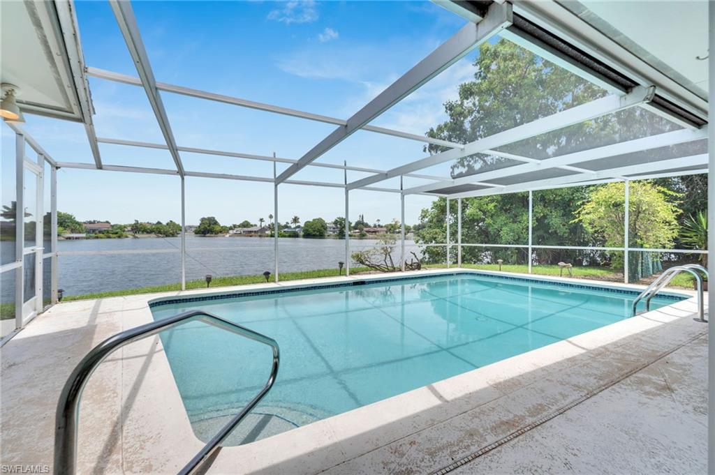 3065 50th Lane Southwest Naples, FL 34116 - Photo 23 of 31 a view of a backyard with a swimming pool