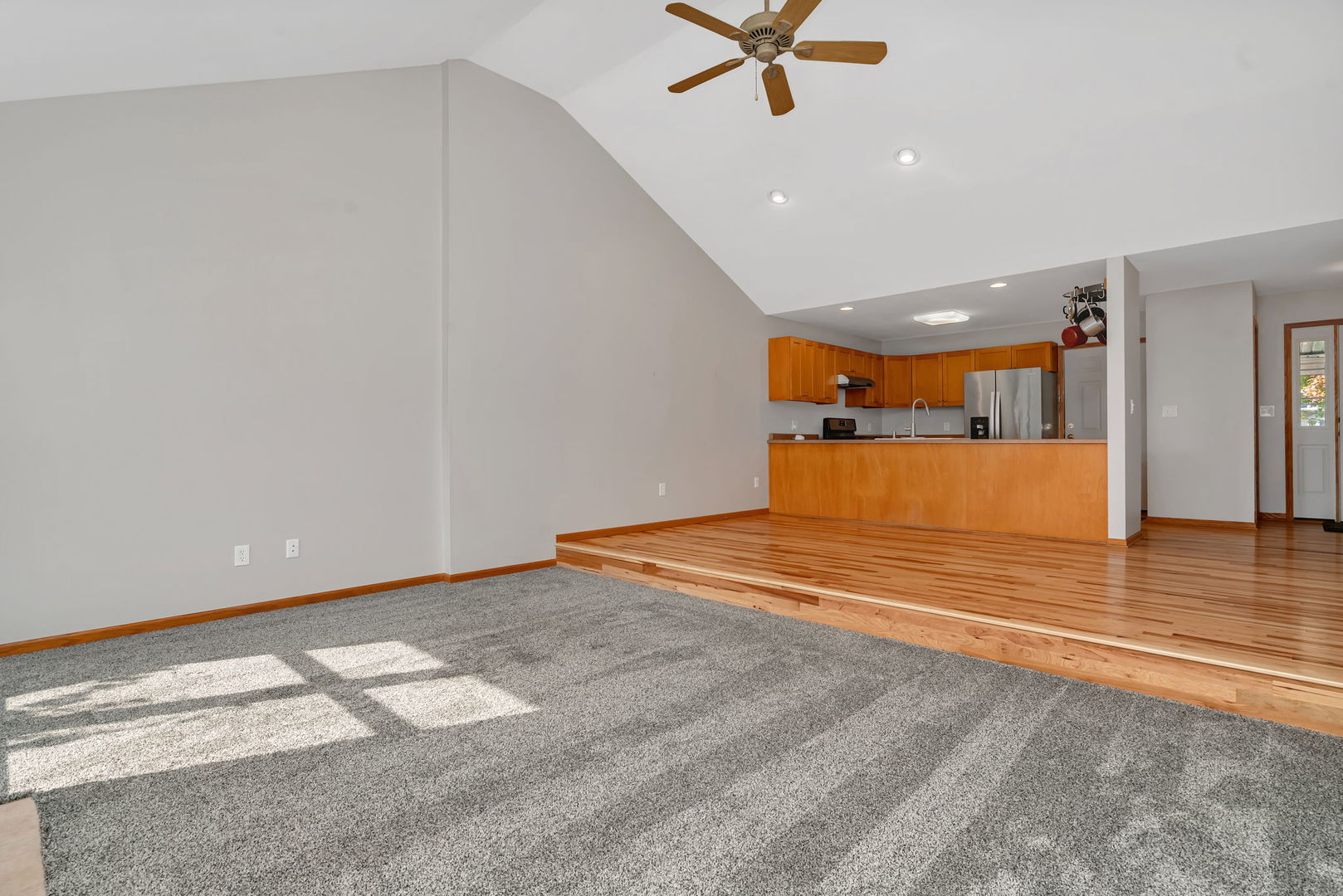 210 Kevin Drive Diamond, IL 60416 - Photo 11 of 23 an empty room with wooden floor and windows