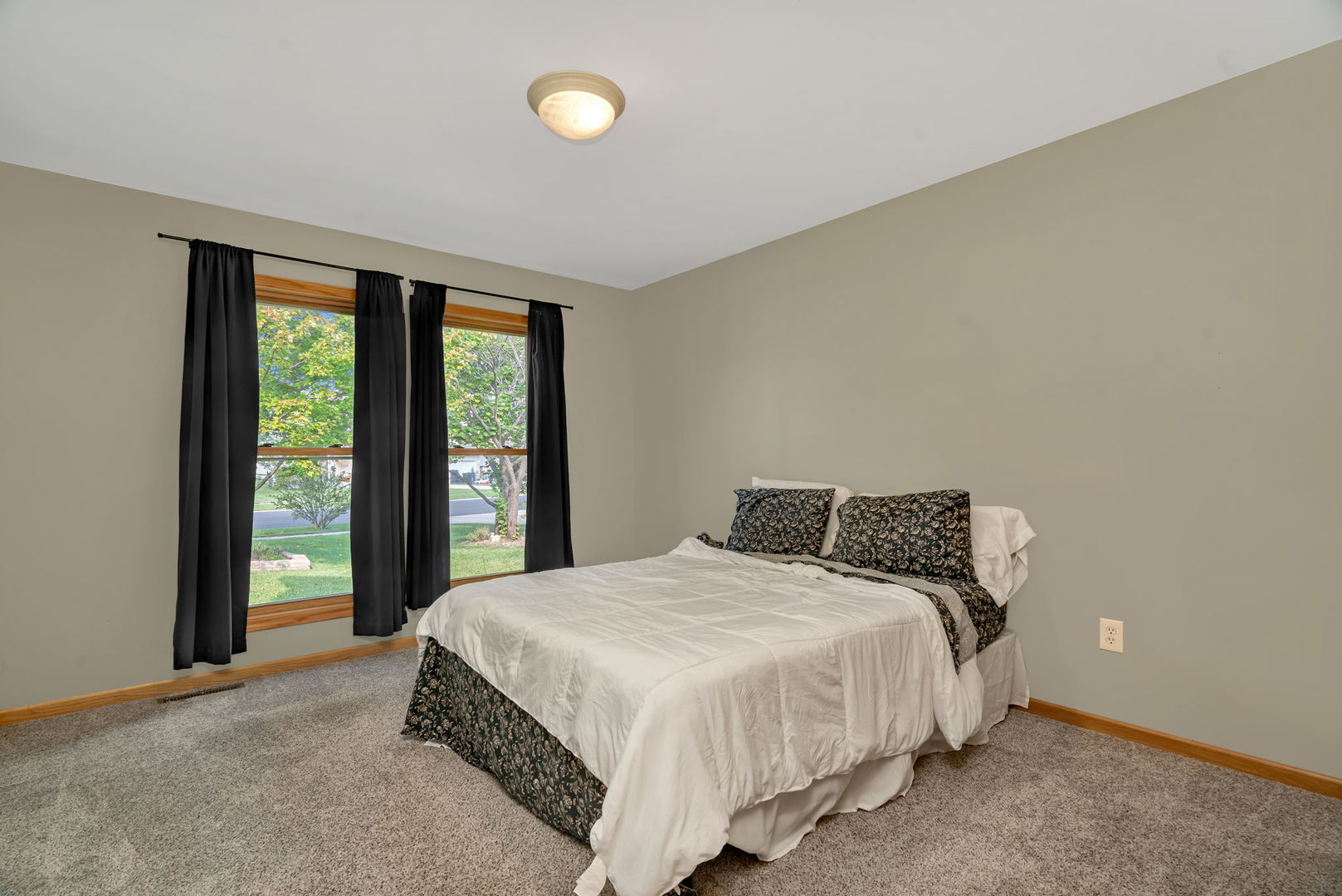 210 Kevin Drive Diamond, IL 60416 - Photo 16 of 23 a bedroom with a bed and a large window