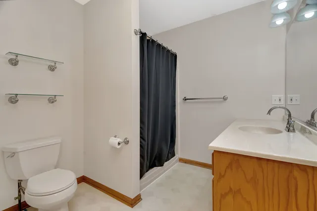a bathroom with a sink toilet and vanity