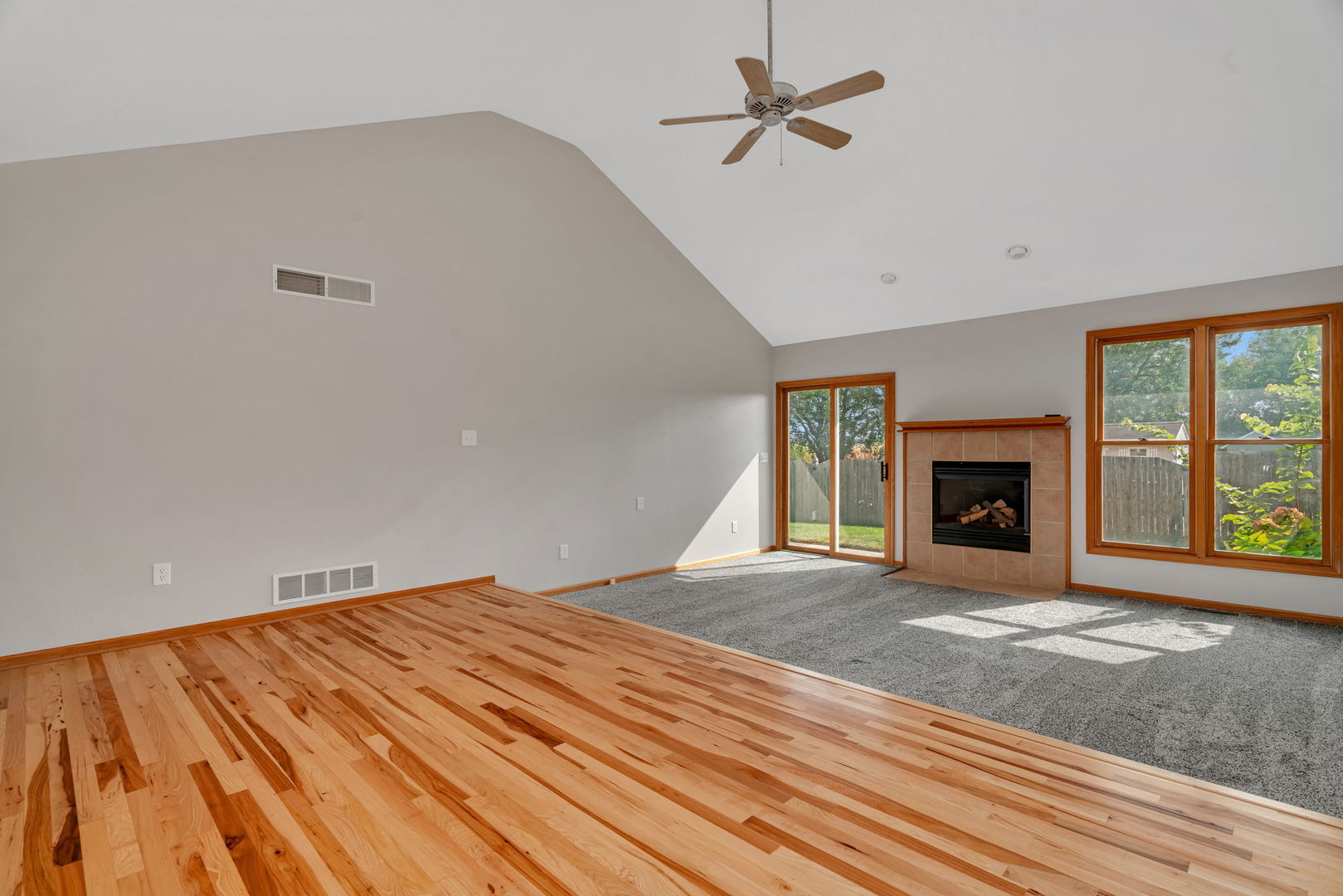 210 Kevin Drive Diamond, IL 60416 - Photo 9 of 23 a view of an empty room with a fireplace and a window
