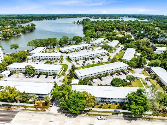 a view of a house with pool and sitting area