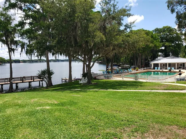 a view of a room that has a baby crib and a dresser