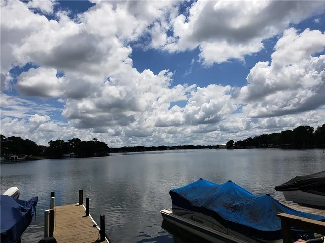 a view of a swimming pool and lounge chair