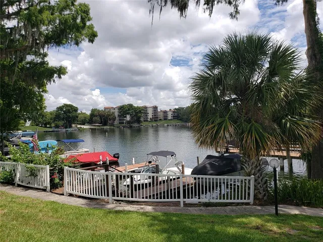a view of a lake with outdoor seating