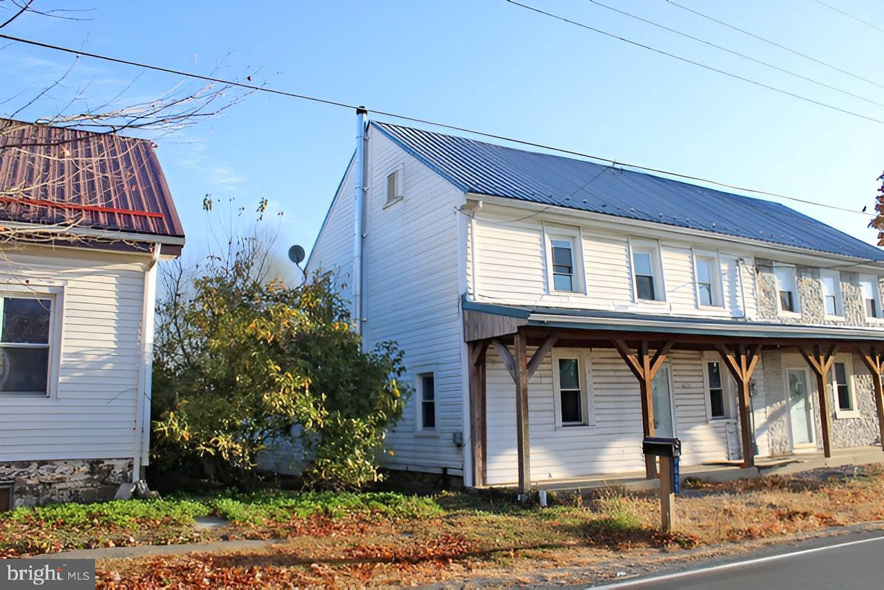 9635 Upper Strasburg Road Pleasant Hall, PA 17246 - Photo 16 of 21 a front view of a house with garden