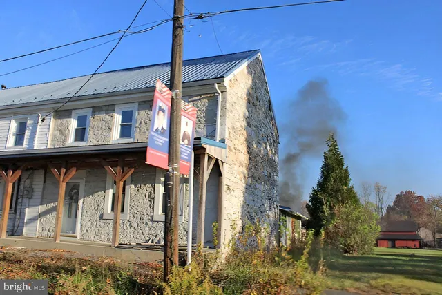 a view of a street with a building in the background