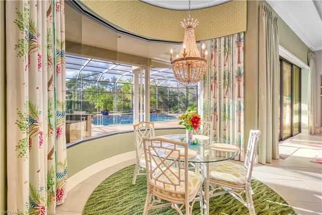 a view of a living room with a large window and table