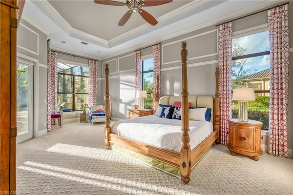 a large bedroom with a large bed and a large window