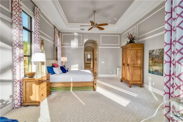 a view of living room with furniture and a chandelier