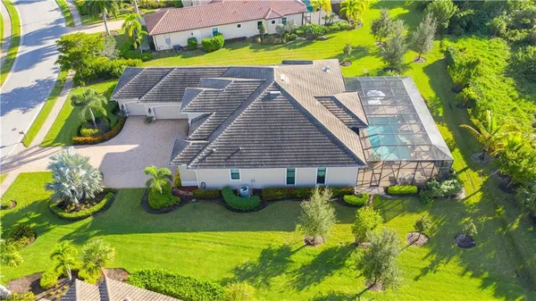a view of swimming pool in front of house