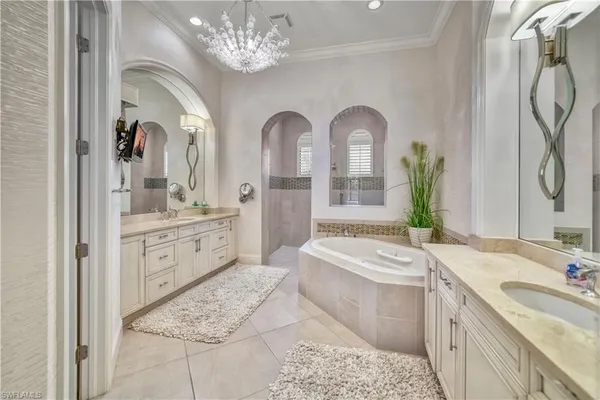 a spacious bathroom with a double vanity sink mirror and