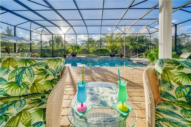 a view of a swimming pool with a patio