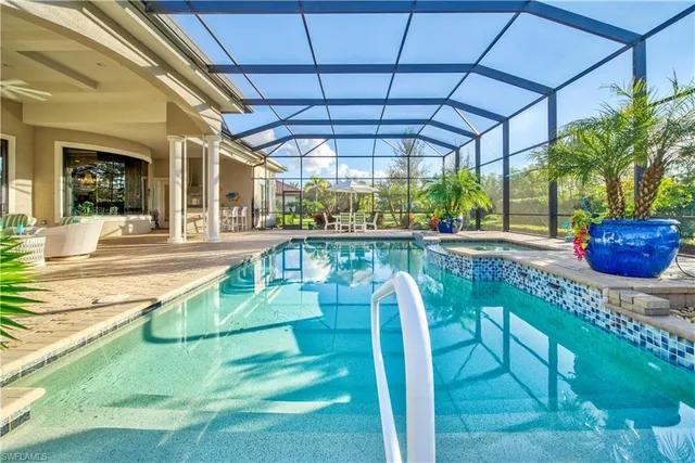 a view of a swimming pool with a patio