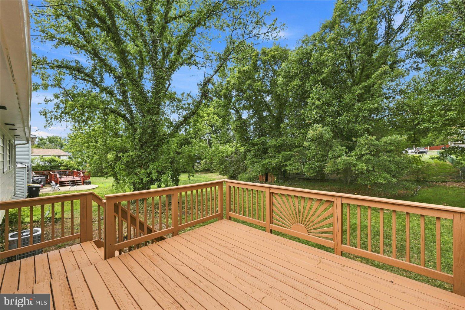 9309 Cross Bow Road Fort Washington, MD 20744 - Photo 43 of 53 Serene deck overlooking lush greenery.