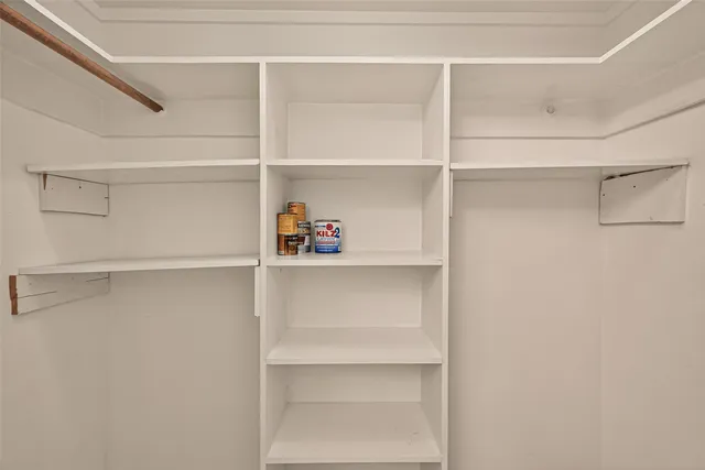 a view of an empty walk in closet