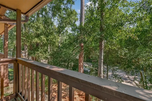 an empty room with windows and cabinet