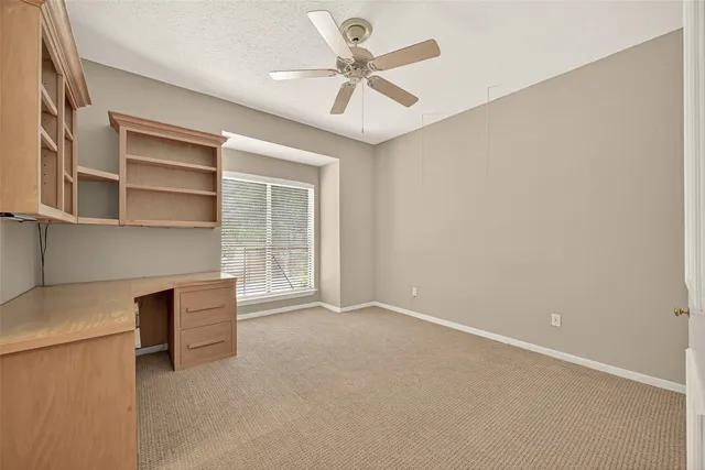 a view of an empty room with a cabinet