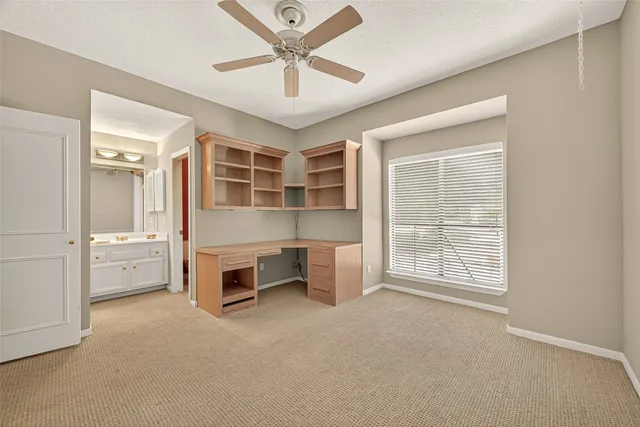 a view of a livingroom with a staircase and a fireplace