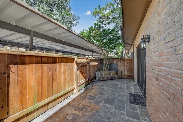 a view of a brick house with a large windows