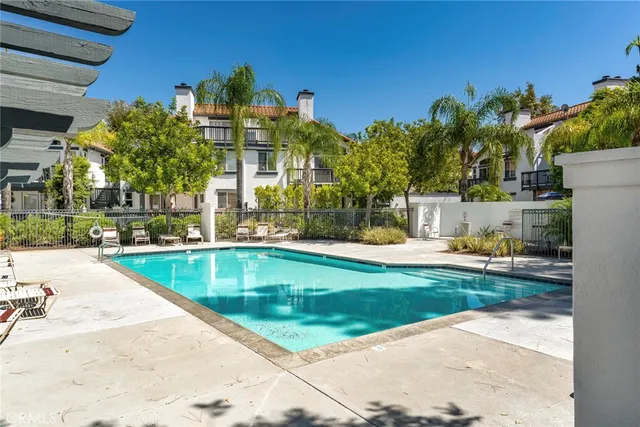a view of a swimming pool with a patio