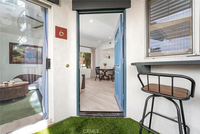 a view of a livingroom with furniture and hardwood floor