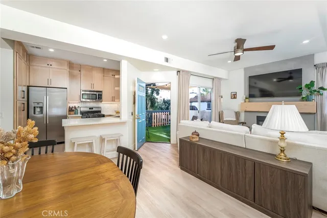 a large kitchen with kitchen island a large counter space a sink appliances and cabinets