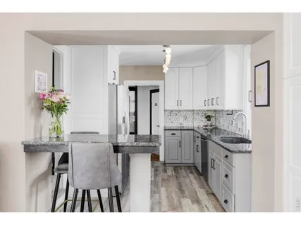 a kitchen with a sink and cabinets