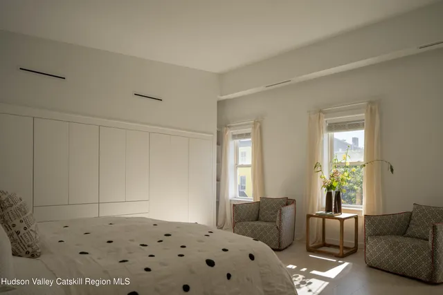 a bedroom with a couch and a couch