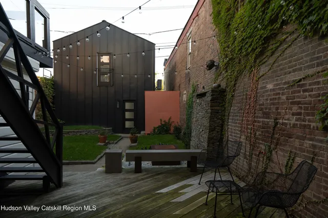 a view of a bench in a backyard