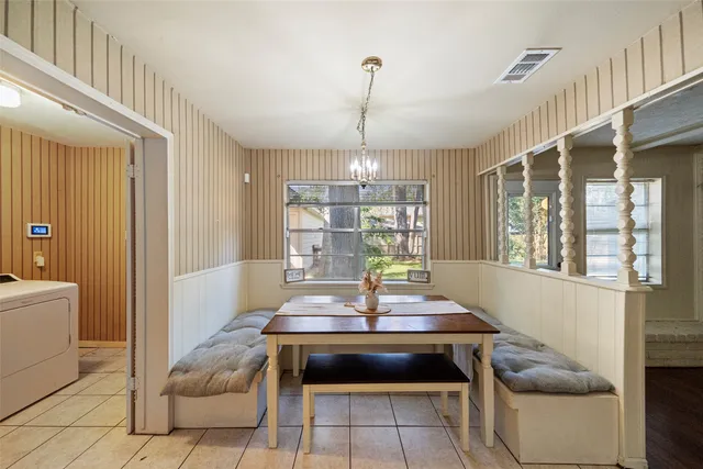 a kitchen with a sink a stove top oven and cabinets