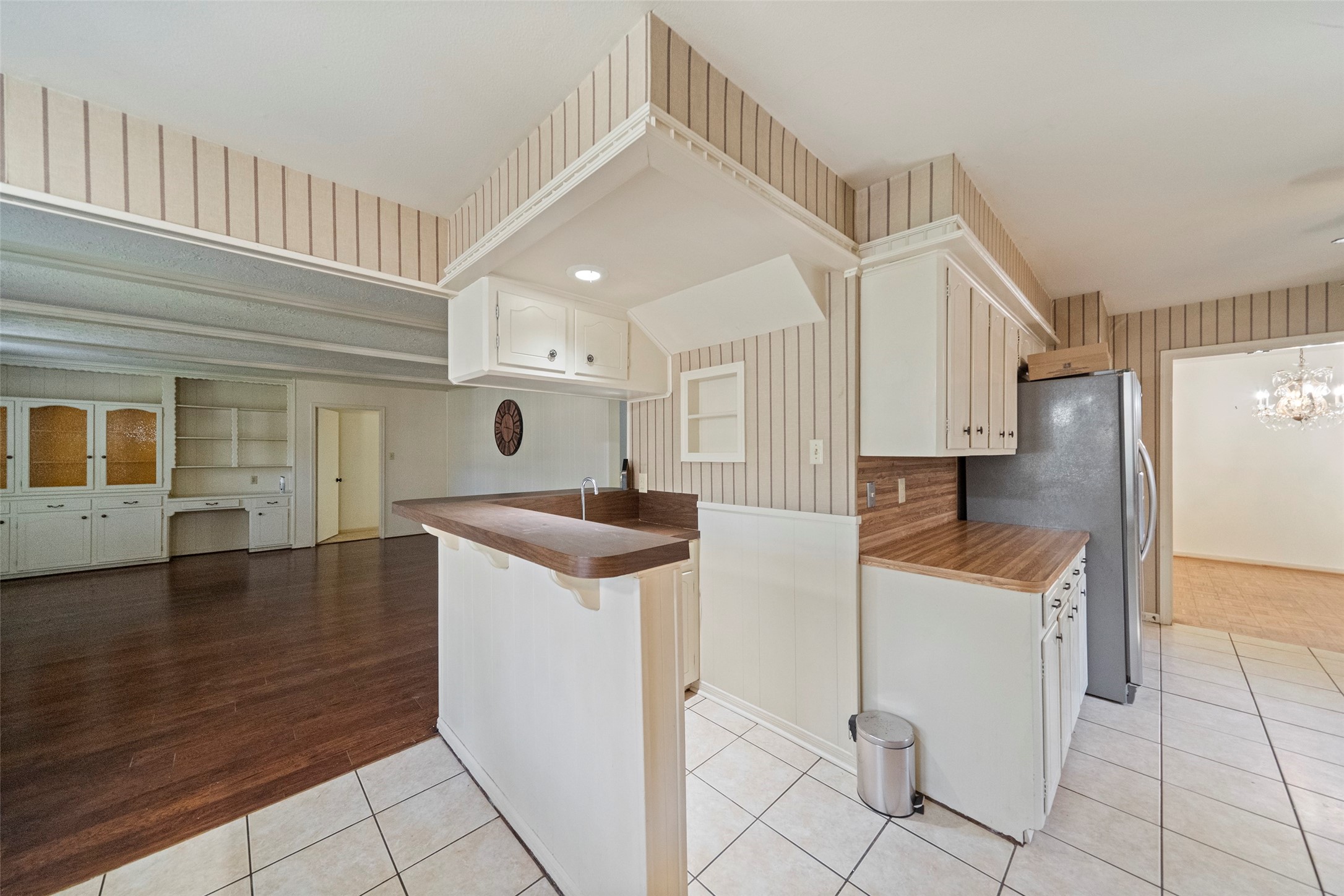 1115 Pear Tree Lane Houston, TX 77073 - Photo 14 of 30 a kitchen with a sink a stove top oven and cabinets