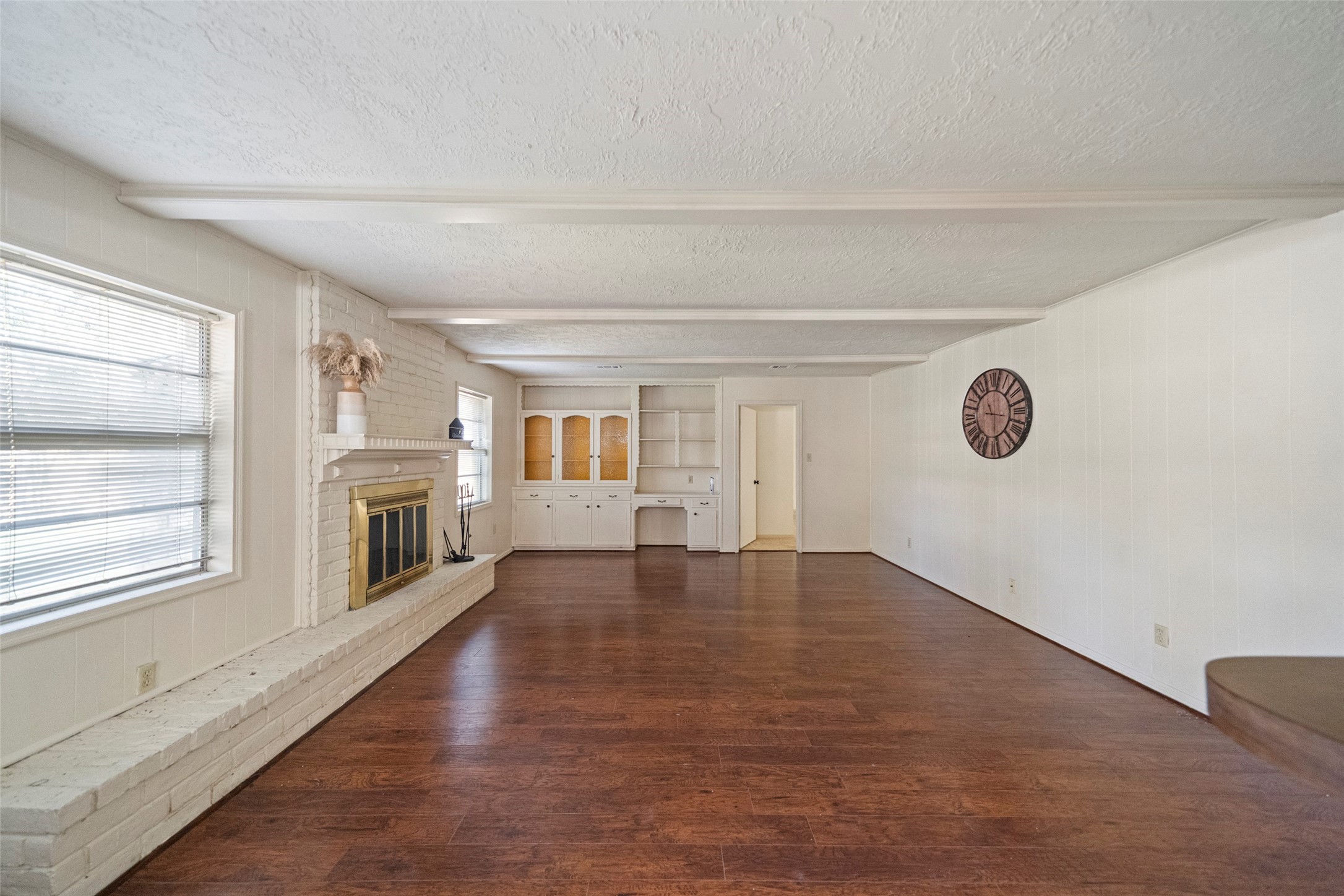 1115 Pear Tree Lane Houston, TX 77073 - Photo 15 of 30 a view of empty room with wooden floor and fireplace