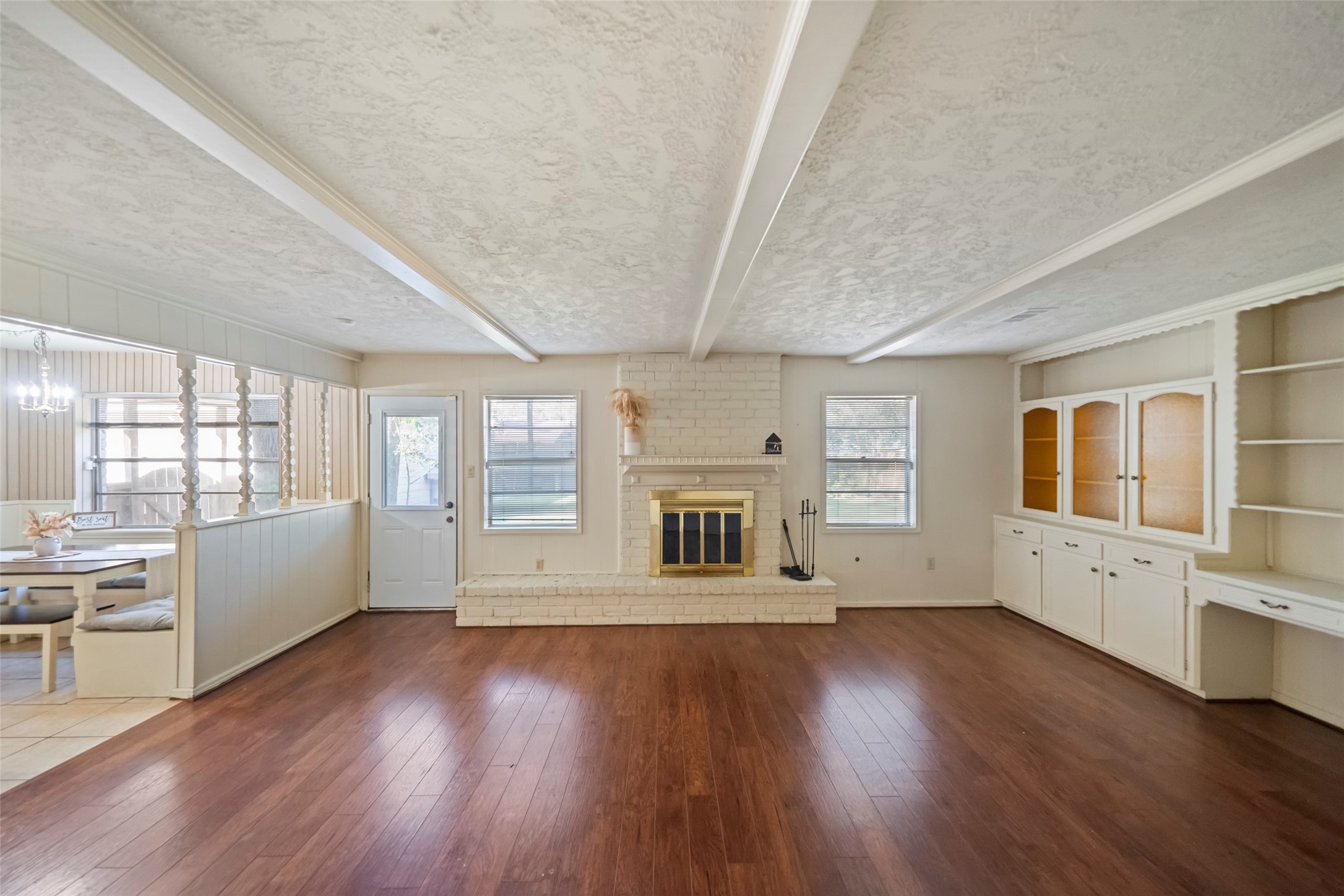 1115 Pear Tree Lane Houston, TX 77073 - Photo 16 of 30 a living room with stainless steel appliances wooden floors and fireplace