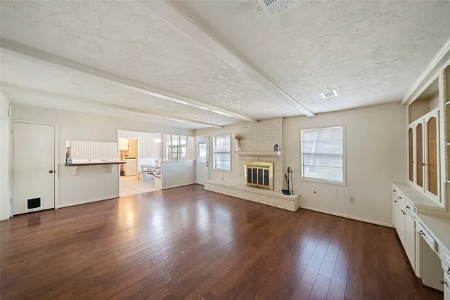 a view of a big room with closet and chandelier fan