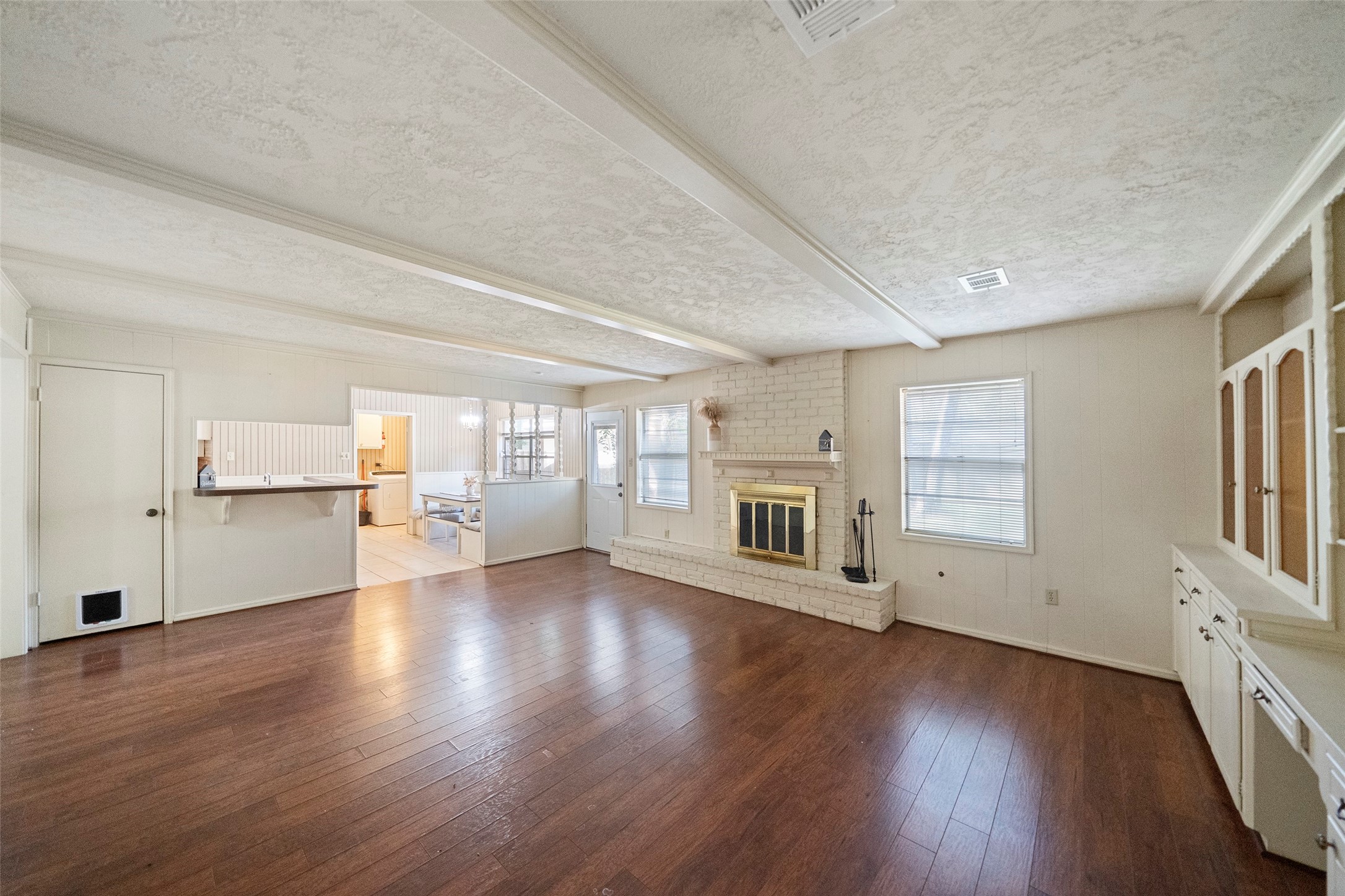 1115 Pear Tree Lane Houston, TX 77073 - Photo 17 of 30 a view of an empty room with wooden floor and a window