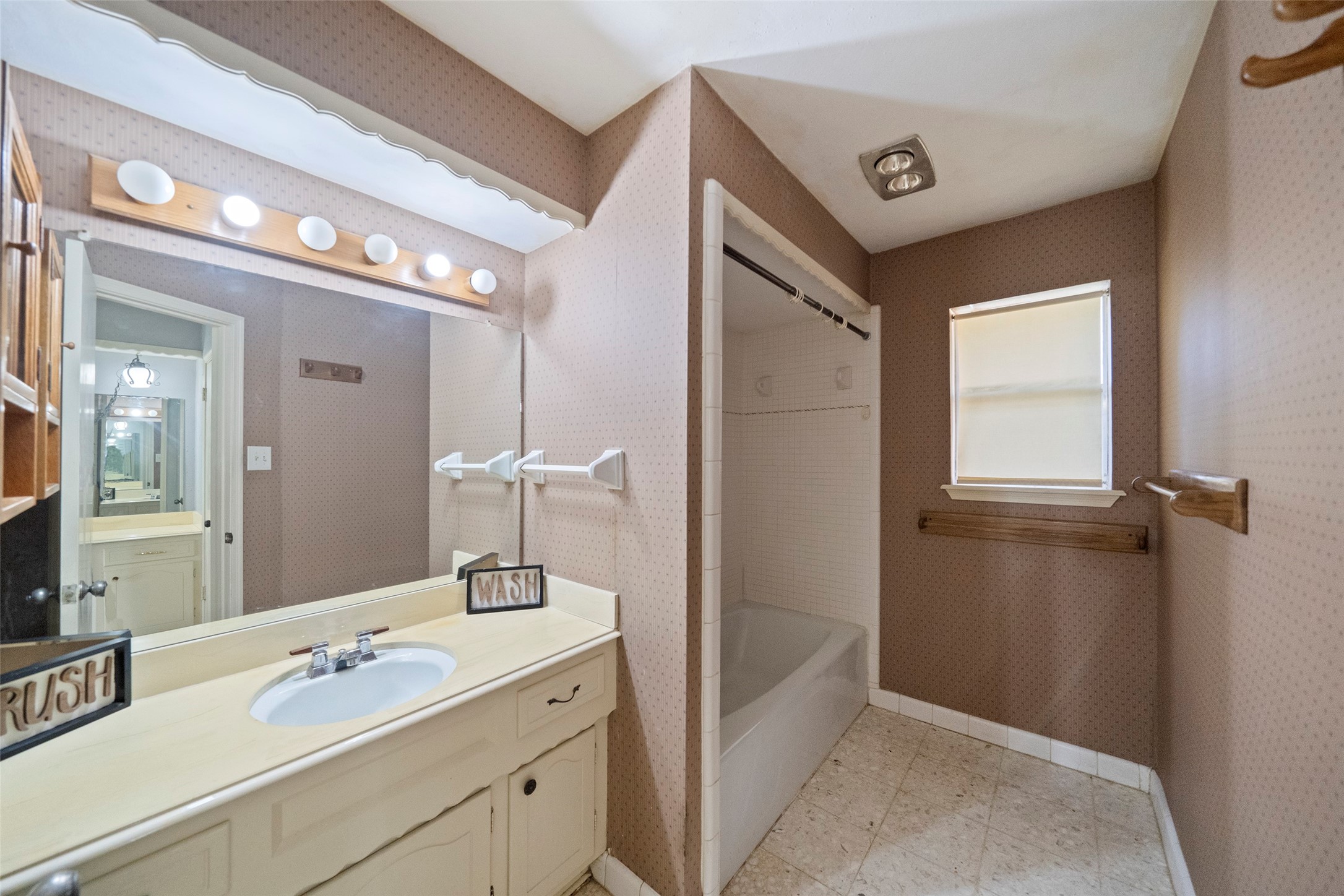 1115 Pear Tree Lane Houston, TX 77073 - Photo 20 of 30 a bathroom with a sink and a mirror