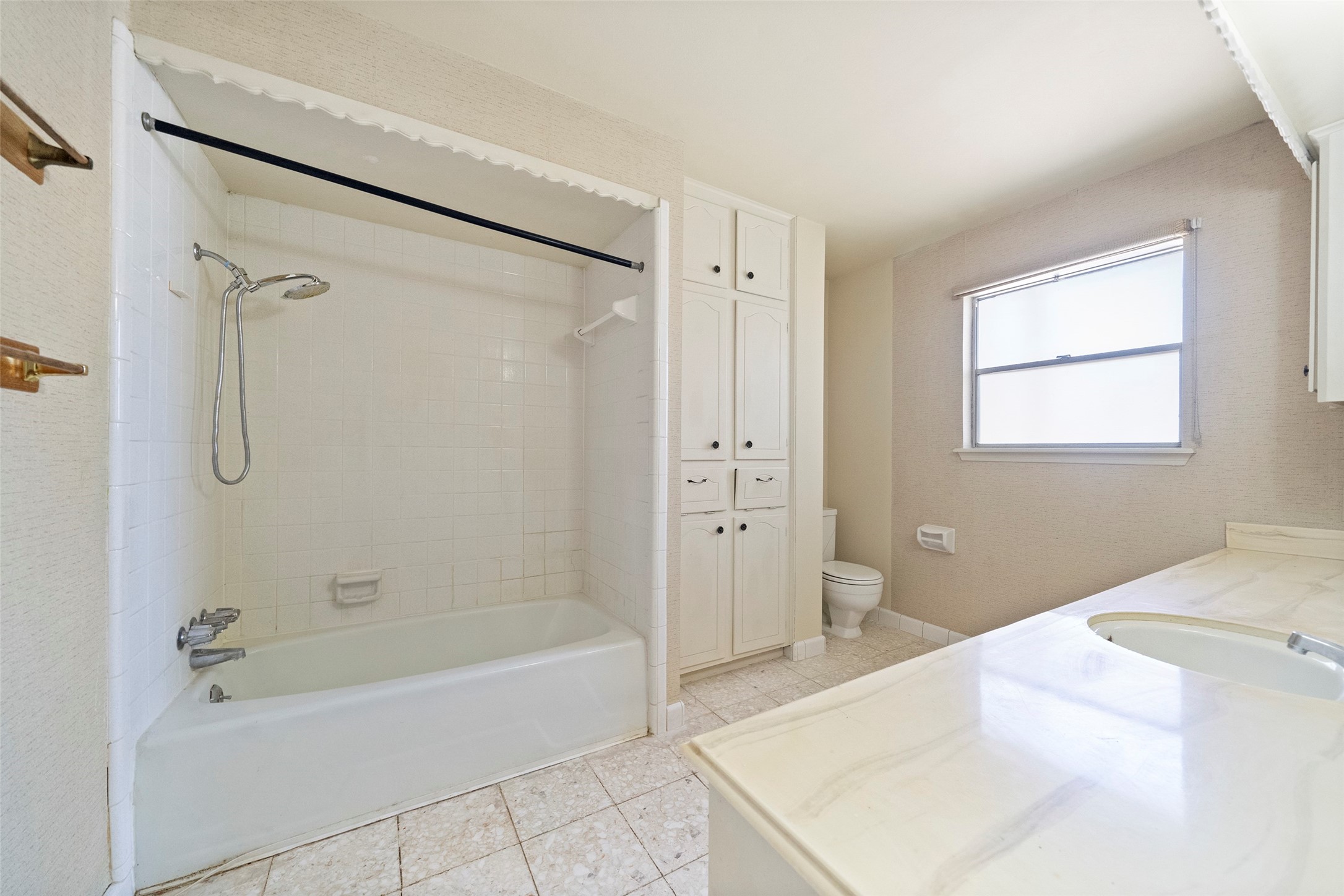 1115 Pear Tree Lane Houston, TX 77073 - Photo 27 of 30 a spacious bathroom with a tub shower and a sink