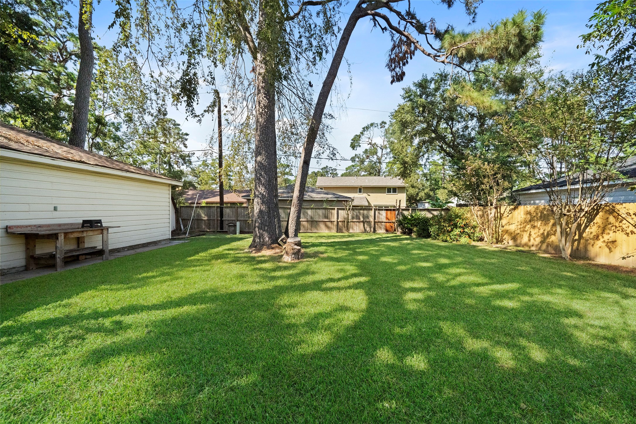 1115 Pear Tree Lane Houston, TX 77073 - Photo 28 of 30 a view of a house with backyard and a tree